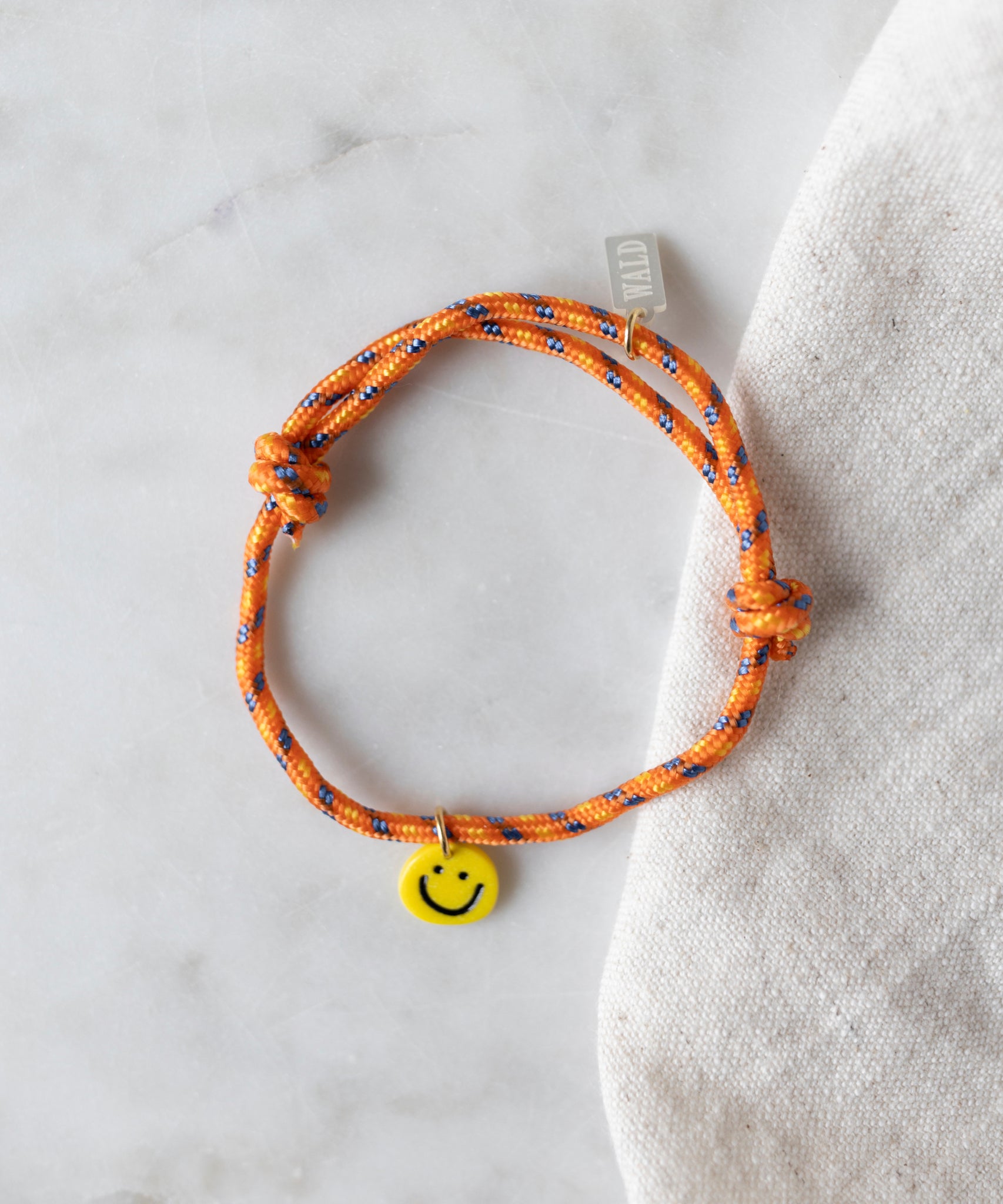 wald-berlin-smilie-dude-orange-freundschaftsarmband image 1