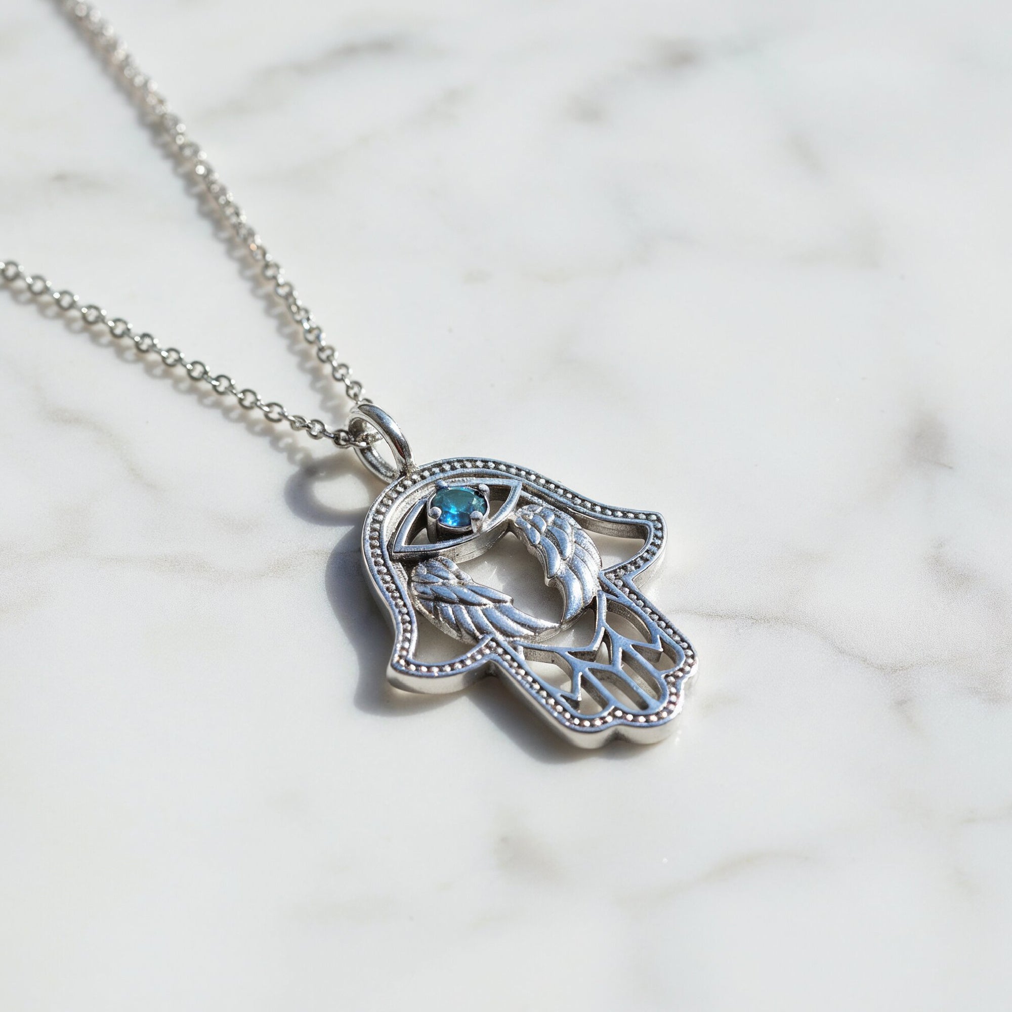 engelsrufer-halskette-925er-silber-hand-der-fatima-mit-zirkonia-blau image 3