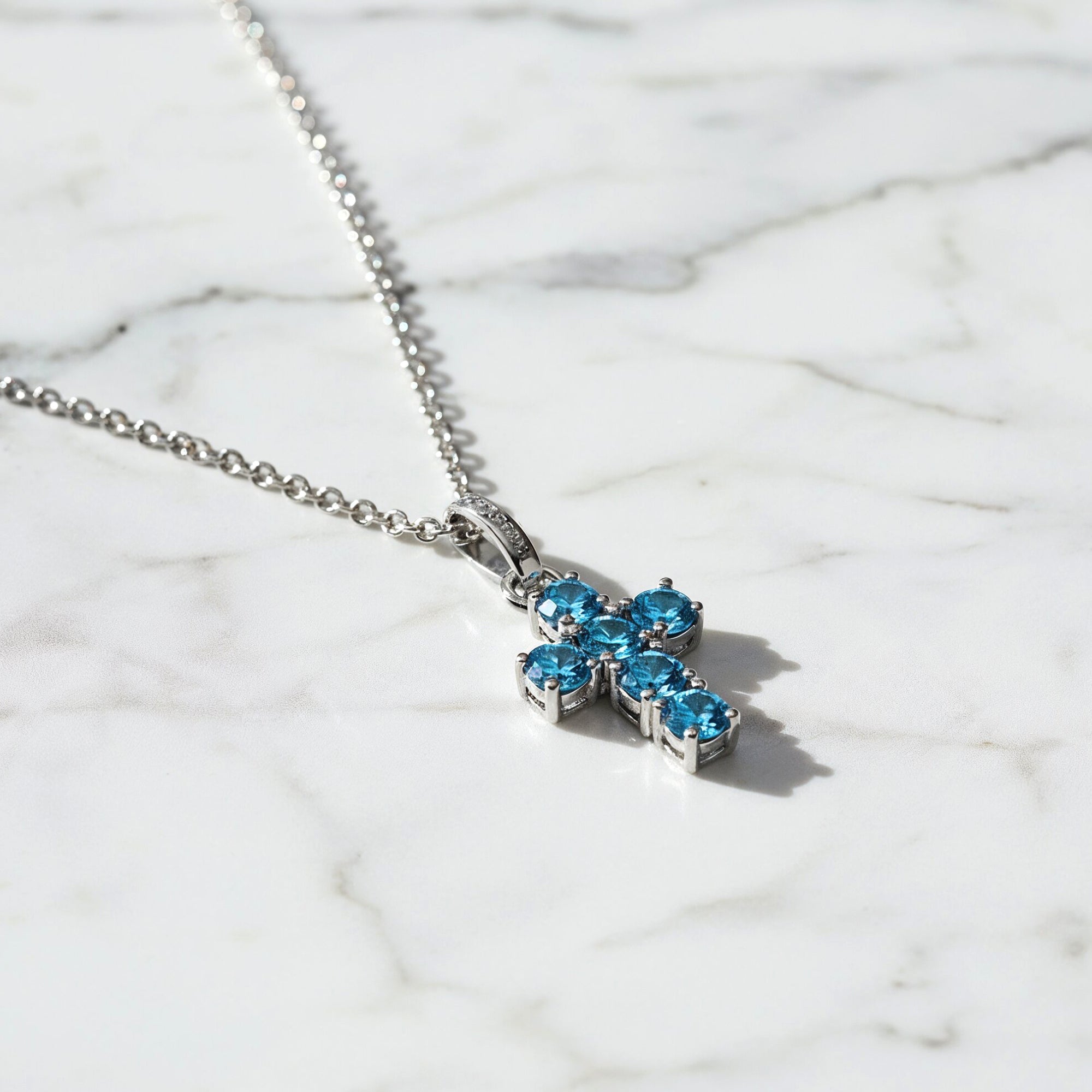 engelsrufer-kreuz-halskette-925er-silber-mit-zirkonia-blau image 3